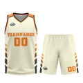 Uniforme de baloncesto personalizado color crema y naranja con tu logotipo-nombre y número impresos